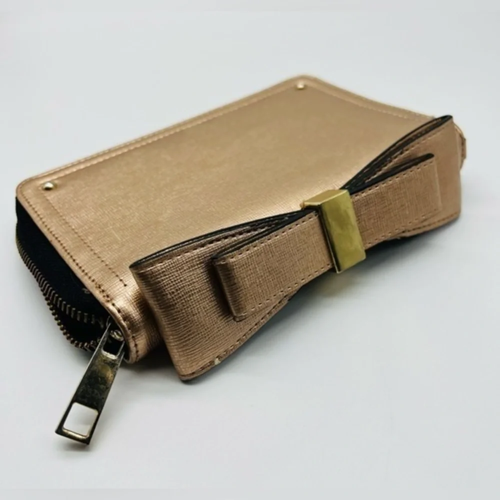 Aldo rose gold wallet with top bow